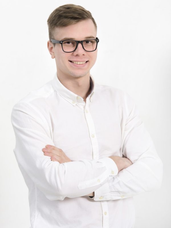 portrait-young-businessman-with-arms-crossed-looking-camera-isolated-against-white-background